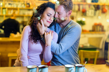Romantic couple having date in coffee shop