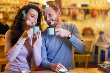 Romantic couple having date in coffee shop