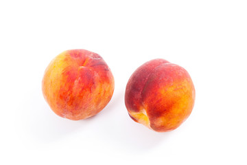 Group of ripe peach fruit isolated on white background.