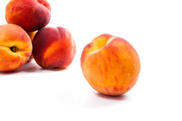 Fototapeta na wymiar Group of ripe peach fruit isolated on white background.
