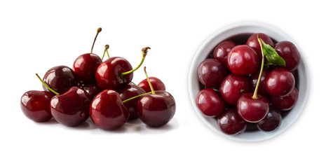 Fresh red cherries lay on white isolated background with copy space. Cherries in a bowl. Background of cherries. Ripe cherry on a white background.