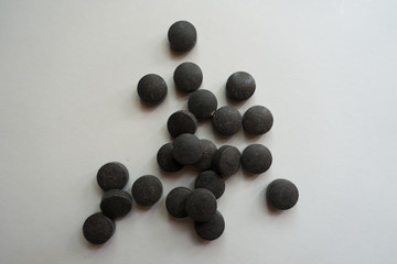 Ferrochel bisglycinate chelate pills on neutral background from above
