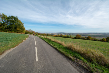 Person walking road in French countryside - 229717309
