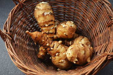 Jerusalem Artichoke (Helianthus tuberosus) vegetable in wicker basket.