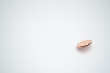 1 dollar coin is placed on a white background.