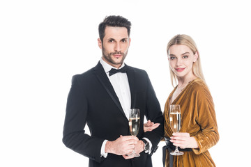 portrait of attractive couple with glasses of champagne isolated on white