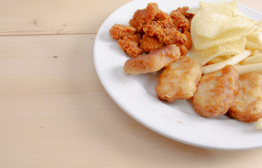 Crisps Fried food in white plate The waistline is on the table.Healthy eating and active lifestyle concept.Do not focus on objects.
