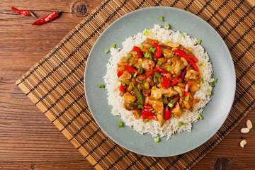 Chicken kung pao. Fried chicken pieces with peanuts and peppers.
