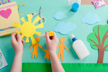Applying glue on paper shape