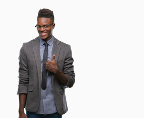 Young african american business man over isolated background doing happy thumbs up gesture with hand. Approving expression looking at the camera with showing success.