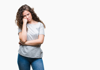 Beautiful young brunette curly hair girl wearing casual look over isolated background thinking looking tired and bored with depression problems with crossed arms.