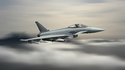 Fototapeta na wymiar armed military fighter jet flying on the speed
