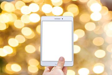 Obraz premium Christmas online sale. Tablet for buying gifts online. Tablet with an empty white screen on the background of Christmas decorations.