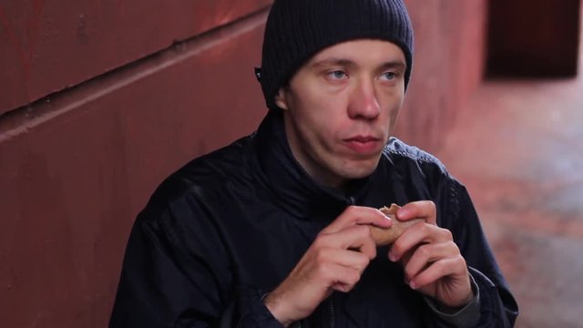 hungry guy eating bread