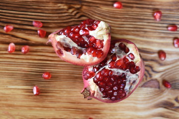 Juicy pomegranates on wood
