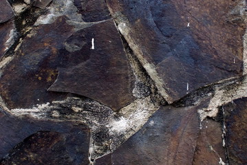 Close up of stone wall texture, with vibrant colors for creativity, imaginative backgrounds and ideas. Suitable for print, web, postcards, posters, flyers.