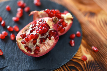 Juicy pomegranates on wood
