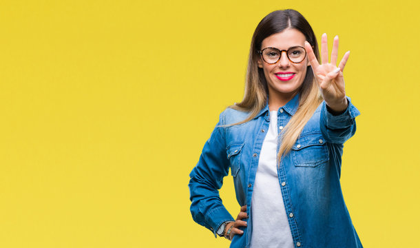 Young beautiful woman over wearing glasses over isolated background showing and pointing up with fingers number four while smiling confident and happy.
