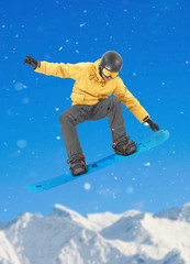 Snowboarder performing a tail grab