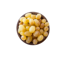Grapes in a wooden bowl isolated on white background. Vegetarian or healthy eating. Top view. Yellow grapes Kish Mish with copy space for text.