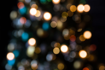 Abstract christmas background with colorful bokeh light effects