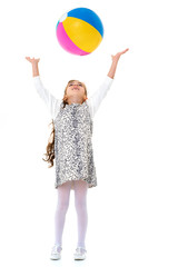 Little girl is playing with a ball