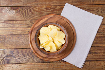 potato chips and napkin on wooden table, holiday concept,mock up