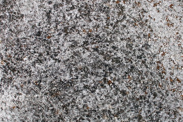Close up of wall and pavement texture for creativity, imaginative backgrounds and ideas. Suitable for print, web, postcards, posters, flyers.