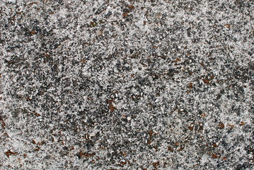 Close up of wall and pavement texture for creativity, imaginative backgrounds and ideas. Suitable for print, web, postcards, posters, flyers.