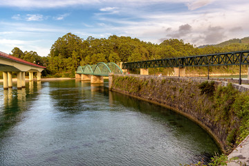Fototapeta na wymiar Three bridges over river Sor in O Barqueiro, Galicia, Spain.