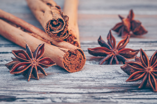 Star anise and cinnamon sticks on a wooden table