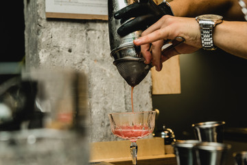 
Barman is making cocktail at night club