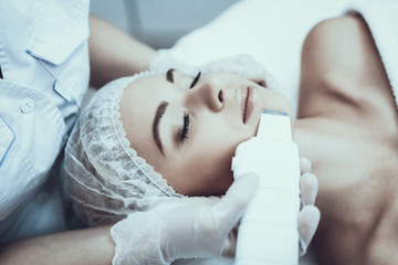 Young Woman in Spa Salon for Laser Hair Removal.