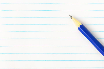 Education concept - blue pencil on book background close-up, mock-up, copy space