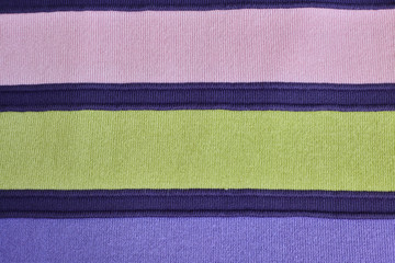 Texture of warm knitted striped clothes