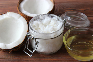 coconuts and coconut oil on a wooden background.