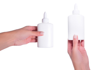 Hand holding pva glue bottle, isolated