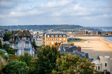 Top view of Trouville city with luxury houses and beautiful beach on the background during the morning light in France