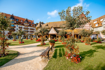 Beautiful garden with luxury hotel building in the center of Deauville city, famous french resort in Normandy