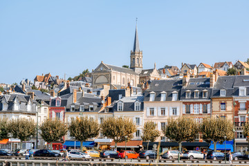 Fototapeta na wymiar Landscape view on the riverside of Trouville village with church tower in the famous french resort in Normandy