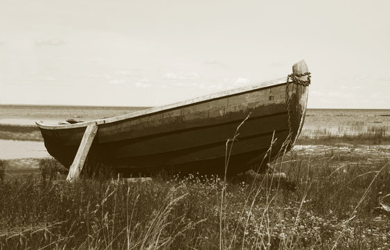 Old wooden boat on the ground