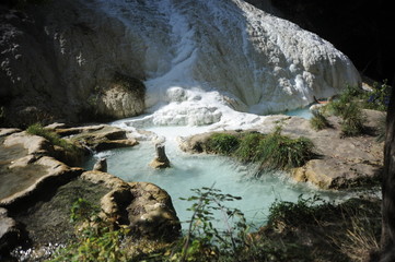 hot spring in Bagni San Filippo thermal center into the wilds of the forest in tuscany, italy