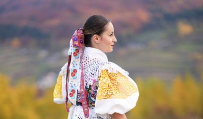 Young beautiful slovak woman in traditional costume