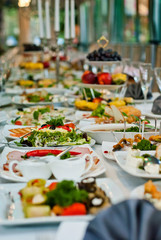 delicious dishes on the table in the restaurant. serving table.