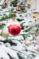 Decorated Christmas tree with garland, fair. Outdoor. Xmas card and pattern. Close up. Winter.