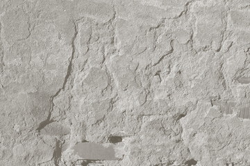 surface of an old wall with cement plaster grunge background texture gray