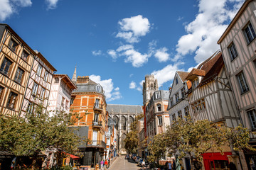 Fototapeta na wymiar Cozy square with beautiful buildings and cathedral on the background in Rouen city, France
