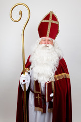 Saint Nicholas with his book looks at you with a smile