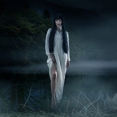 Halloween scary brunette woman with long hair
