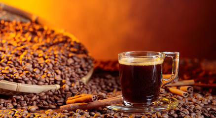 Espresso coffee cup with cinnamon sticks.